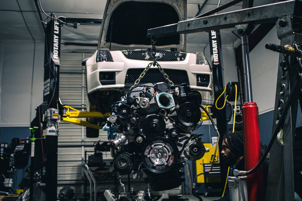 Engine out of the car on the lift during a build
